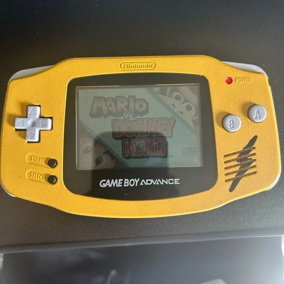 Custom (Pika) Gameboy advanced and Pokémon Red and Gold games.